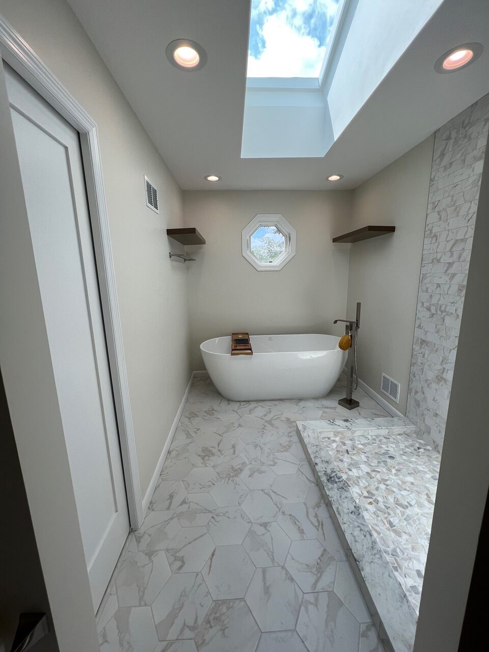 Bathroom with skylight and soaking tub
