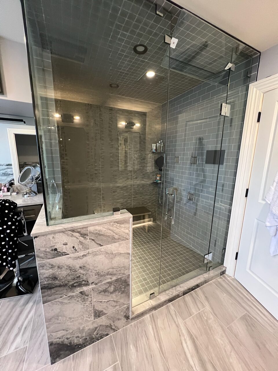 Glass-enclosed marble shower